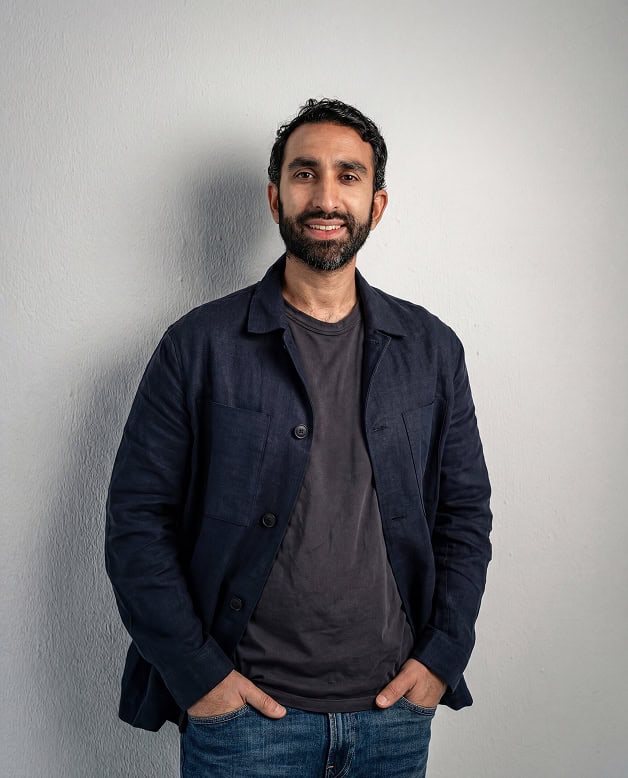 Manick Bhan delivering a speech at a professional event.